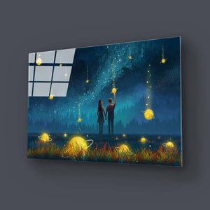 Couple Under Falling Planets Glass Wall Art